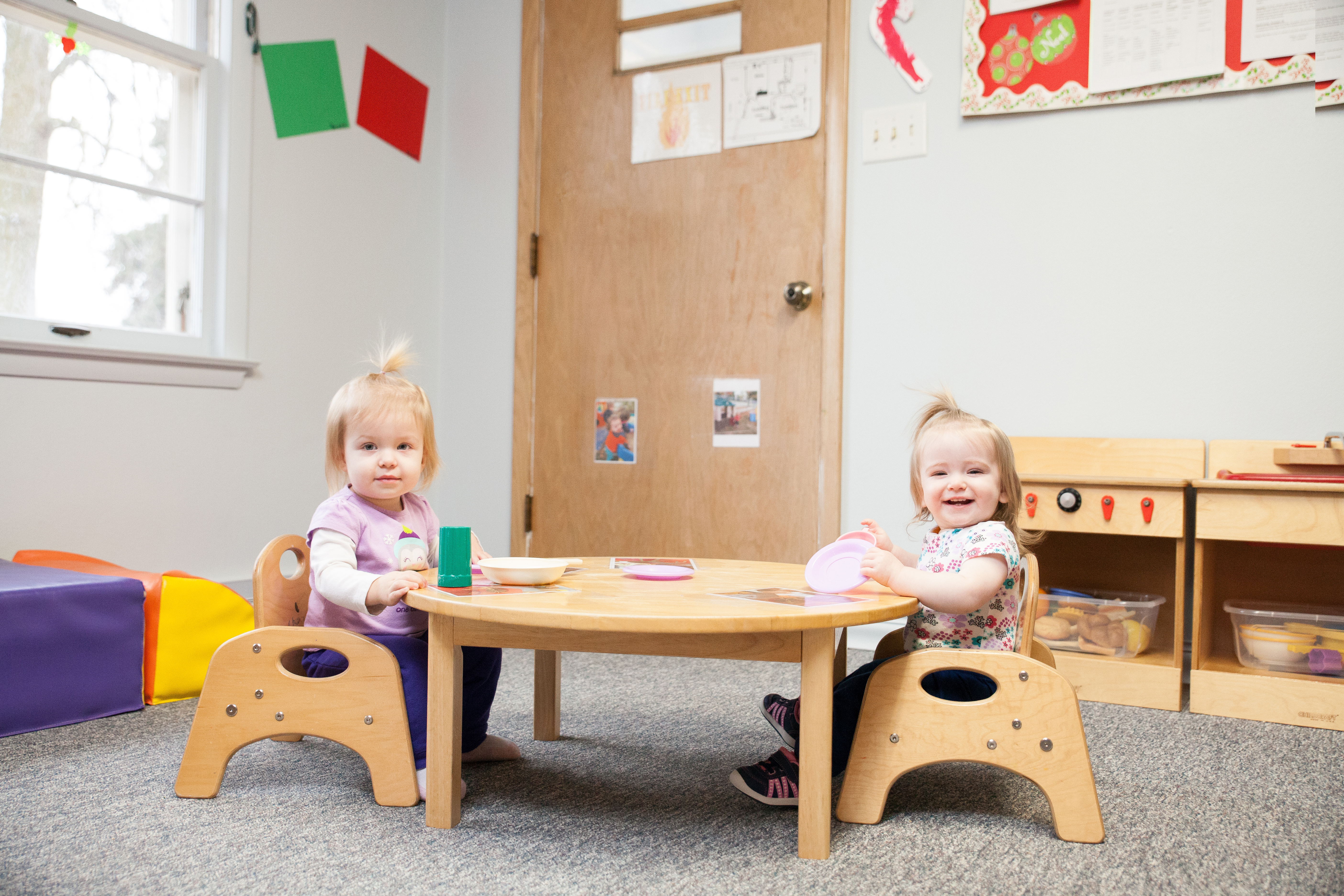 infant girls eat at Community Child Care Center